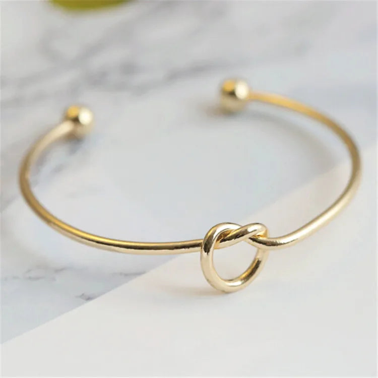 Gold Bracelet with Knot Detail