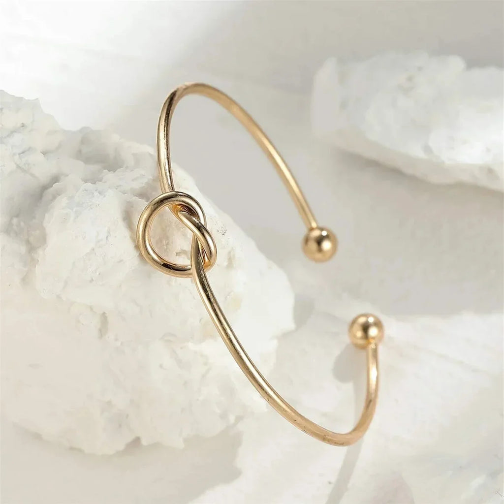 Gold Bracelet with Knot Detail