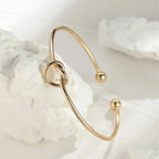 Gold Bracelet with Knot Detail
